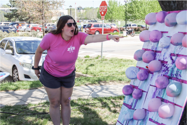 Washburn University’s Zeta Tau Alpha  celebrates Zeta Tau Alpha Dart Throw, where people can throw darts at balloons full of acrylic paint and pop them on canvases. The event happened on the ZTA front lawn, 1845 SW Jewell, on the Washburn campus April 17.